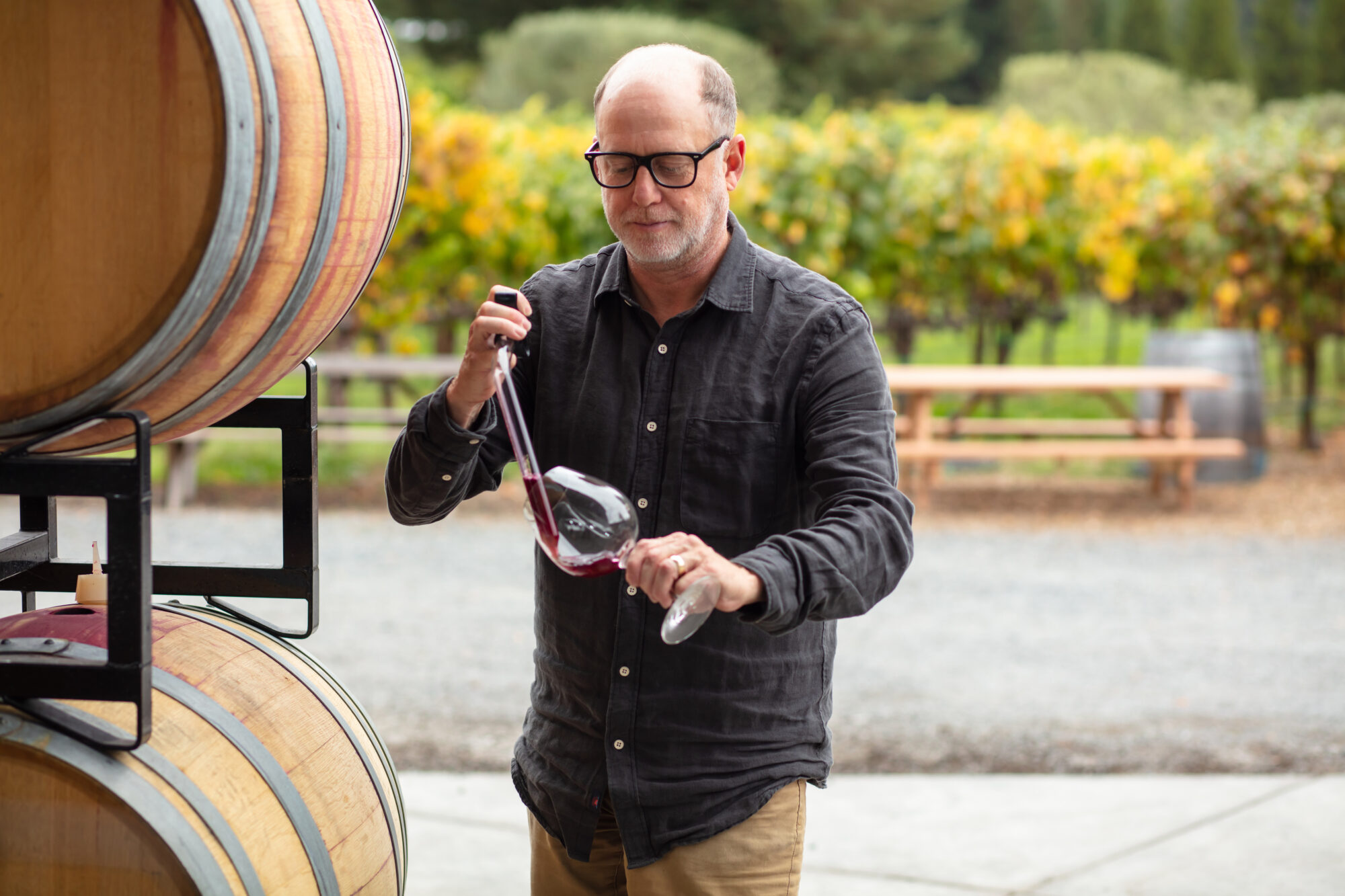 Winemaker Using Pipette to Transfer Wine Into Glass
